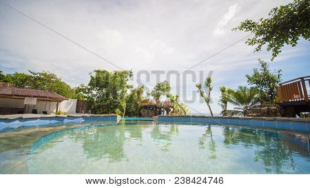 Outdoor Pool In A Tropical Country Philippines. Evening Time