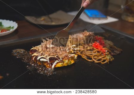 Chef Cooking Okonomiyaki; Japanese-style Pancake Or Pizza