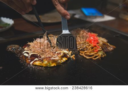 Chef Cooking Okonomiyaki; Japanese-style Pancake Or Pizza