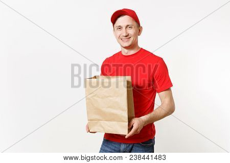 Delivery Man In Red Uniform Isolated On White Background. Male Courier In Cap, T-shirt Holding Empty