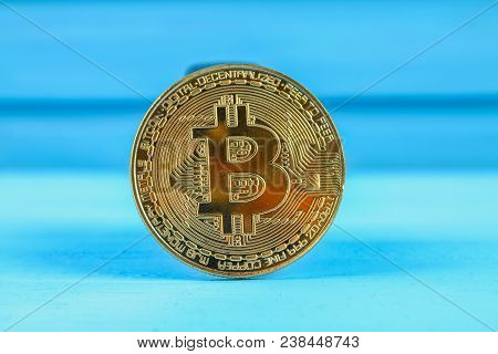 Gold Coin Crypto Currency Bitcoin On A Blue Table