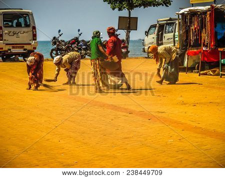 Unknown Woman Cleaning The Street Of Palolem In Goa India October 25-2017 On The Morning