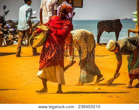 Unknown Woman Cleaning The Street Of Palolem In Goa India October 25-2017 On The Morning