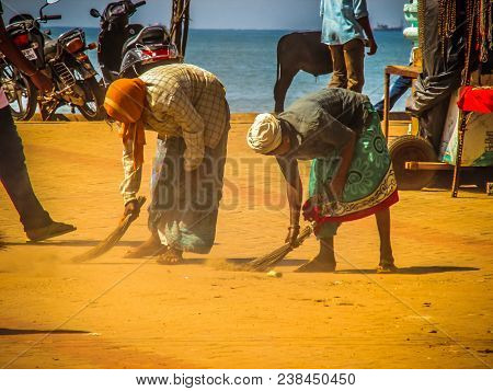 Unknown Woman Cleaning The Street Of Palolem In Goa India October 25-2017 On The Morning