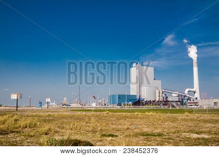 Rotterdam , Netherlands - April 20 2018 : The Uniper Coal Power Plant Producing Energy At The Maasvl