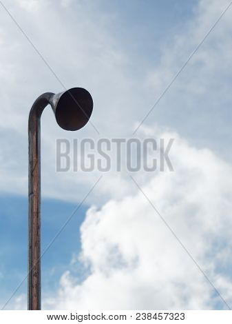 Induction Or Suction Pipe With Head For Testing Air And Noise Pollution Over Bright Blue Sky Backgro