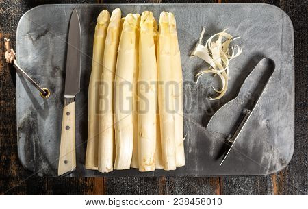Top View, Fresh Tasty White Asparagus, Seasonal Vegetable, New Harvest, With Piller And Knife, Ready