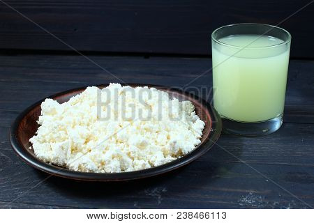 Curds And Whey In A Glass On Wooden Background