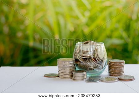 Coin In Glass Bottle With Money Stack Step Up Growing Growth Saving Money, Concept Financial Busines