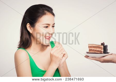 Beautiful Smiling Asian Young Woman With A Chocolate Cake Isolated On White Background.