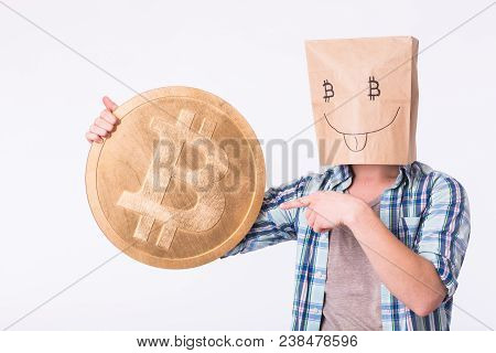 Golden Bitcoin In A Man Hand, Digitall Symbol Of A New Virtual Currency