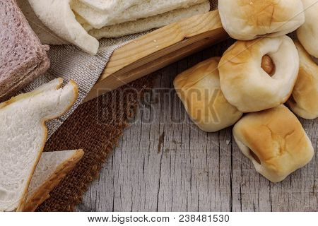 Baked Bread And Other On Wooden Boards.