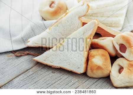 Breaded Ham And Stuffed On Wooden Floor.