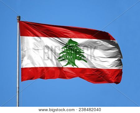 National Flag Of Lebanon On A Flagpole In Front Of Blue Sky.