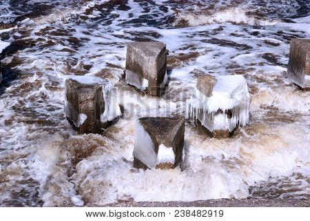 Strange Triangle-shaped Concrete Structure In Boiling River Water In Spring In Spring