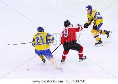 Kyiv, Ukraine - April 25, 2017: Alex Rauchenwald Of Austria (c) Fights For A Puck With Denys Isayenk