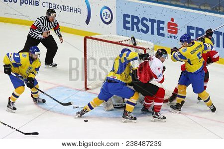 Kyiv, Ukraine - April 25, 2017: Ukrainian Ice-hockey Players (yellow Jersey) Fight For A Puck With A