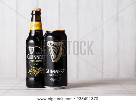 London, Uk - April 27, 2018: Bottle And Aluminium Can Of Guinness Draught Stout Beer Bottle On Light