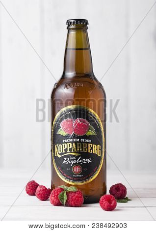 London, Uk - April 27, 2018: Cold Glass Bottle Of Kopparberg Premium Raspberry Cider  On White Backg