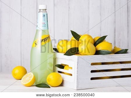 London, Uk - April 27, 2018: Bottle Of Schweppes Lemon Juice Sparkling Drink On Wooden Background Wi