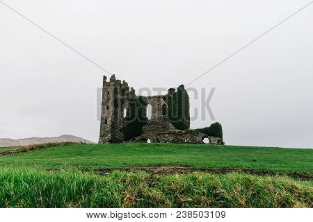 Old Ruins Of The Castle Of Cahersiveen In Ireland A Misty Day