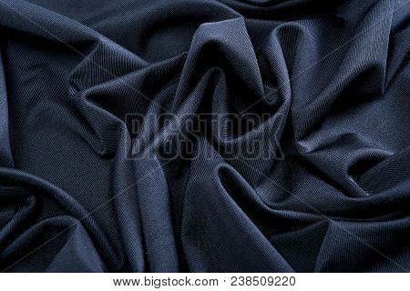 Smooth Gray Satin Silk Fabric. Folds, Curl. Satin Background.