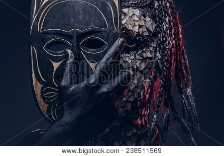 Close-up Portrait Of A Witch From The Indigenous African Tribe, Wearing Traditional Costume. Make-up