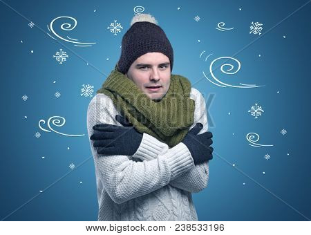 Young hipster frozen boy with doodled snowflakes and windy concept
