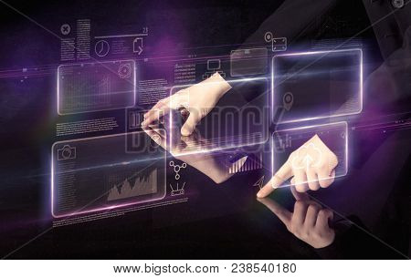 Male hands touching interactive table with purple cloudspace graphic on it 