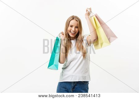 Shopping And Lifestyle Concept: Young Happy Summer Shopping Woman Smiling And Holding Shopping Bags 