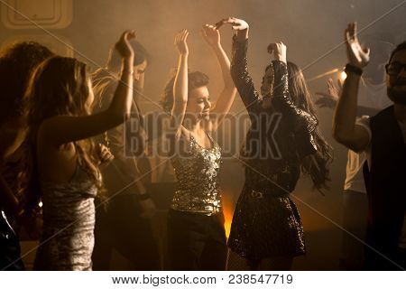 Crowd Of Trendy Young People Having Fun Enjoying Raving Nightclub Party, Beautiful Girls Dancing On 