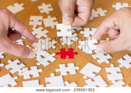 Three Business People Are Connecting Jigsaw, Teamwork Concept.