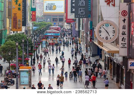 Chengdu, Sichuan Province, China - April 18, 2018: People On The Famous Pedestrianized Shopping Stre