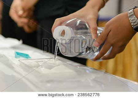 Pouring Normal Saline Into Medical Nursing Set