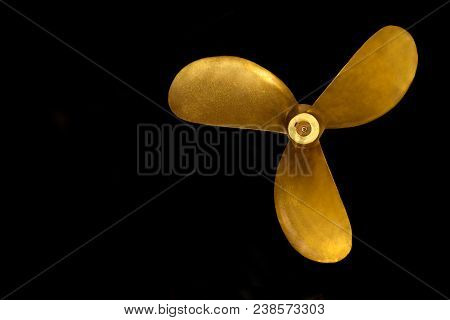 An Old Bronze Propeller Isolated On Black. Concepts Of Direction, Leadership, Navigation, Power, Dri