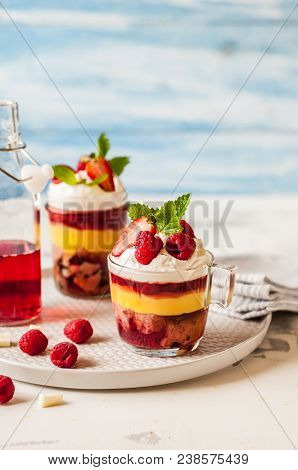 Fruit Cake, Jelly, Custard, Berry And White Cocolate Whipped Cream Individual Trifles, Copy Space Fo