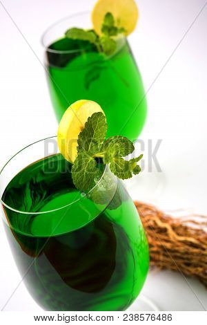 Green Khus Sharbat Or Vetiver Grass Extract Or Chrysopogon Zizanioides Served In Tall Glass With Min
