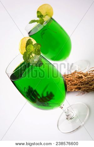 Green Khus Sharbat Or Vetiver Grass Extract Or Chrysopogon Zizanioides Served In Tall Glass With Min