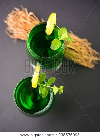 Green Khus Sharbat Or Vetiver Grass Extract Or Chrysopogon Zizanioides Served In Tall Glass With Min