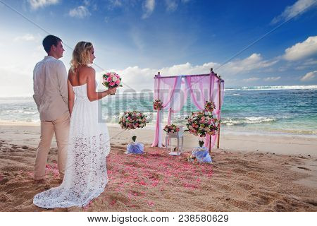 Wedding Couple Just Married At The Beach, Hawaii. Wedding Ceremony In Hawai