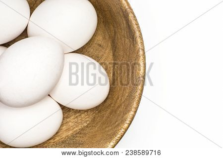 White Chicken Eggs In A Wooden Bowl Top View Isolated On White Background