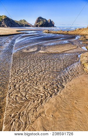 Textured Sand In A Stream Bed At Low Tide, Piha Beach, Auckland Region, New Zealand.
