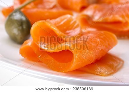 Smoked Salmon - On A Plate With A Caperberry. Shallow Dof.