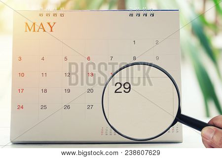 Magnifying Glass In Hand On Calendar You Can Look Twenty-nine Day Of Month,focus Number Twenty-nine 