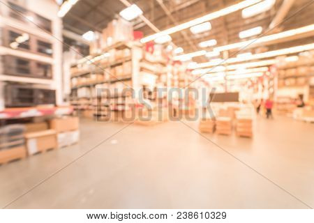 Blurred Large Furniture Warehouse Customer Shopping In America