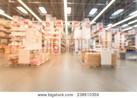 Blurred Large Furniture Warehouse Customer Shopping In America