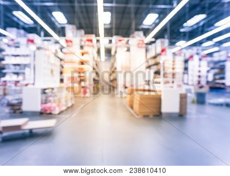 Blurred Large Furniture Warehouse Customer Shopping In America