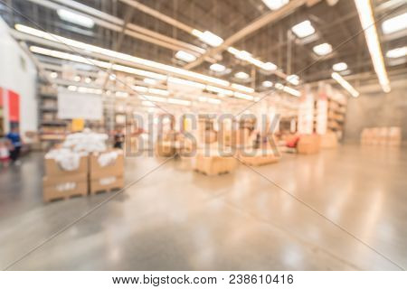 Blurred Large Furniture Warehouse Customer Shopping In America