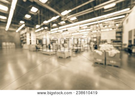 Blurred Large Furniture Warehouse Customer Shopping In America
