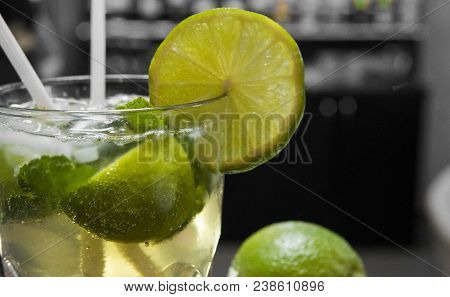 Closeup Glass Of Unalcohol Mohito Cocktail With Lime And Mint Decorated With Slice Of Lime And With 